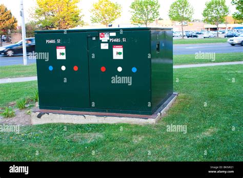 green electric box|green electrical box in street.